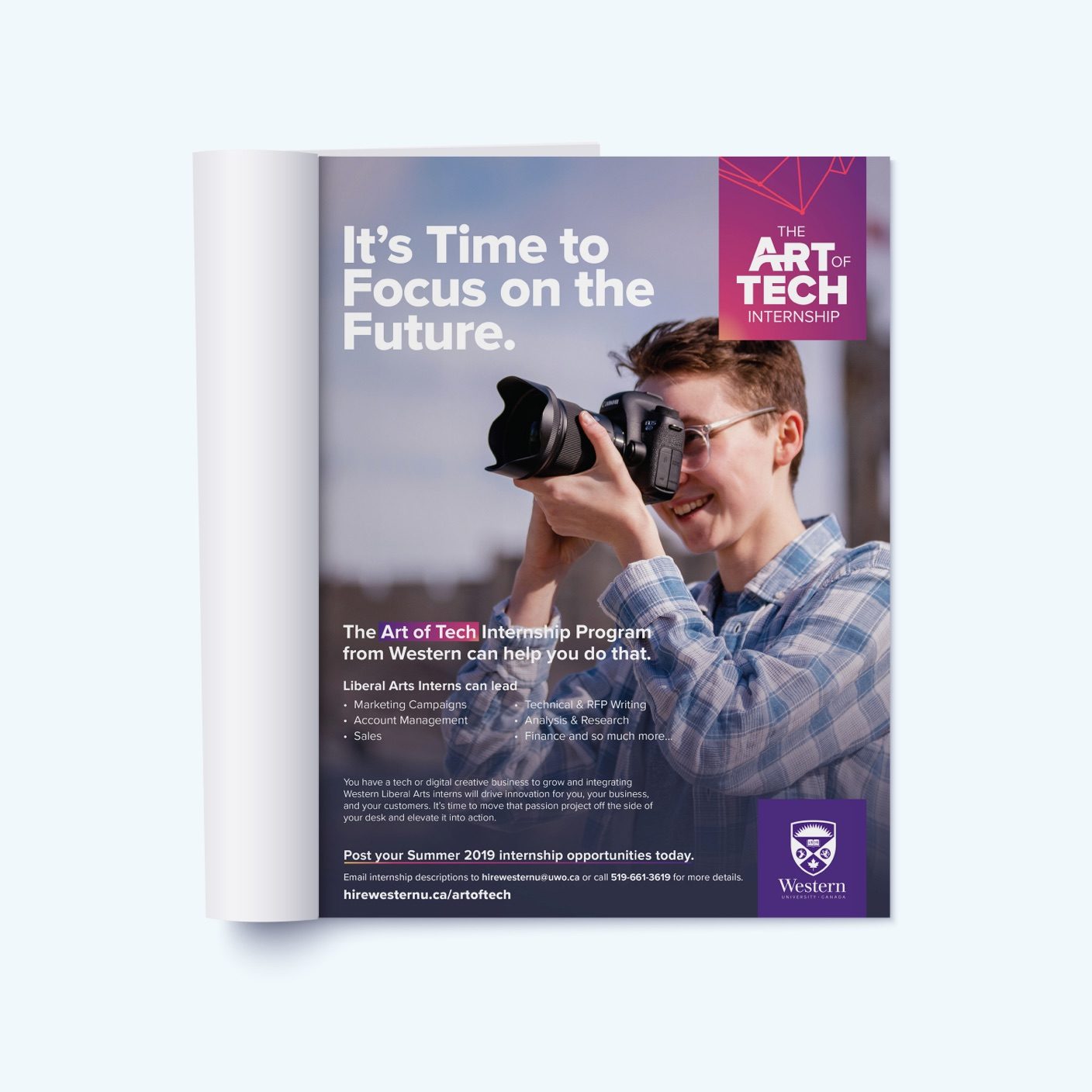 Magazine flipped to page with a person looking into the lens of a camera